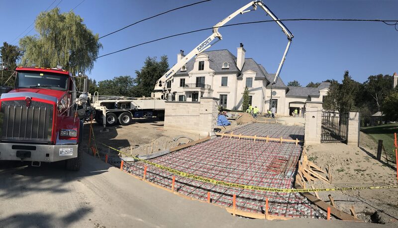 A Pro-Land crane truck setting stone
